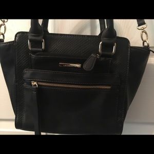 Liz Claiborne Black purse with strap or handles.